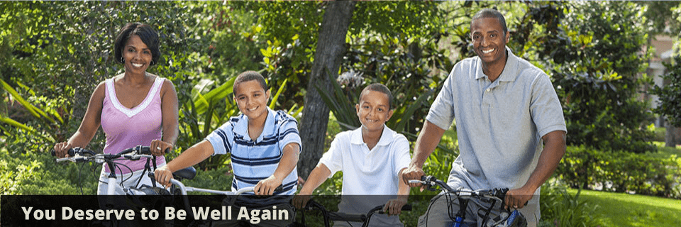  Family riding bikes in park 
